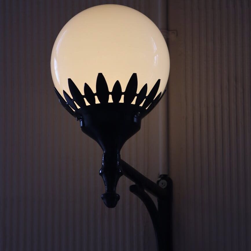 spherical lamp glowing on a wall
